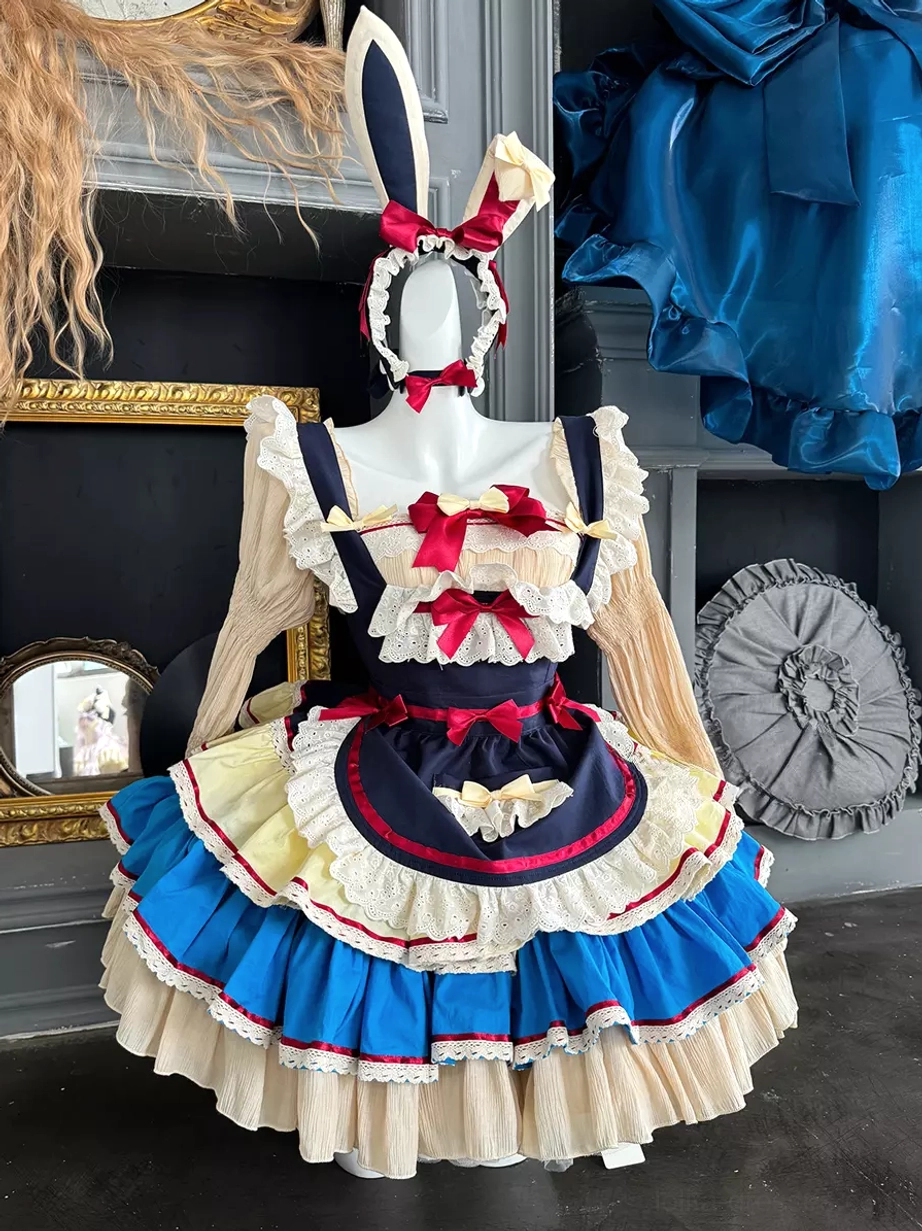 Deep blue rabbit maid lolita dress worn on dress form front view showing tiered ruffled skirt, detachable long sleeves, and complete sweet lolita ensemble