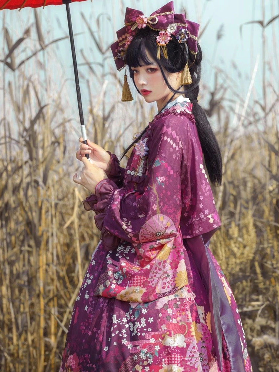 Deep purple floral lolita coat dress side profile view showing wide kimono sleeves tassel earrings bow hair ornaments and floral patterned fabric