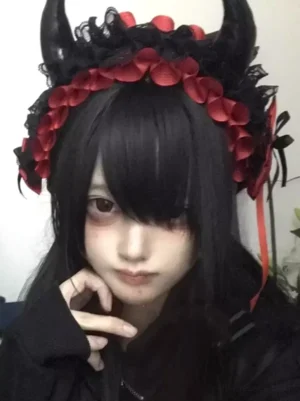 Devil horn lolita hair headdress with red side ribbons and black lace petal decoration front view