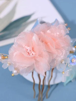 Dual-flower hair comb design with fluffy pink sheer roses, decorative resin beads, and delicate pearl accents showcasing intricate Lolita-inspired craftsmanship and detail work