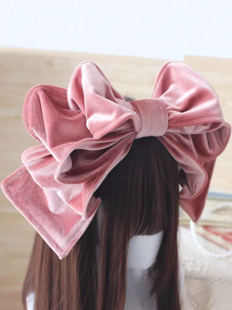 Dusty pink velvet Lolita headdress with romantic oversized double-bow design on straight brown-haired mannequin in casual indoor setting, perfect for sweet lolita daily wear coordination