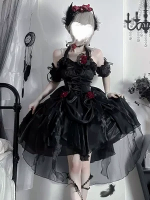 Black Gothic Lolita JSK dress with off-shoulder halter neckline, red rose embellishments, and high-low tulle hem - front three-quarter view on model