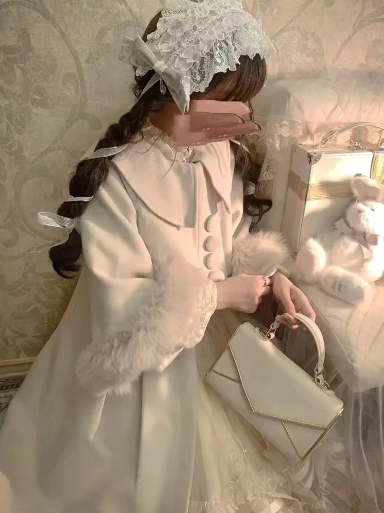 Side profile view of beige sweet lolita wool overcoat with round fabric buttons, fluffy fur cuffs, masked model with holiday gift decorations, coordinating handbag accessory, showing elegant line and romantic silhouette from side angle