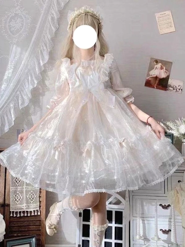 Ecru white sweet lolita dress full-body front view vintage indoor setting featuring sheer tulle ruffled square neck bow
