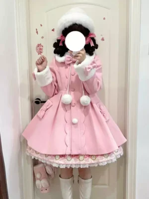 Pink sweet lolita winter overcoat with white fur trim, pom pom decorations, and lace ruffled hem, worn with pink hair bows and fuzzy white hat for complete vintage lolita coordinate