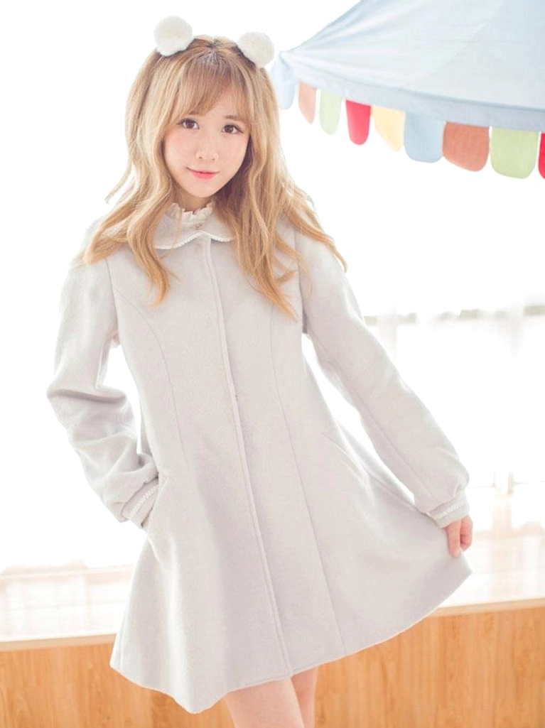 Three-quarter front view of the elegant grey wool sweet lolita overcoat showcasing the doll collar structure, plain wool fabric quality, flared hem design, and overall structured silhouette essential to lolita fashion aesthetic