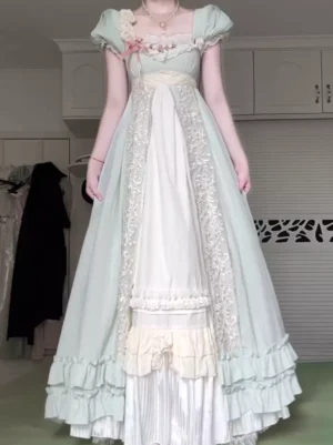 Sage green sweet lolita dress with puffed short sleeves, square neckline with pink bow floral detail, empire waist, layered ruffled skirt, and lace embroidery panels - full body front view