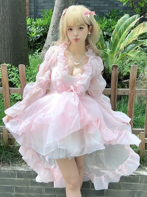 Enchanted fairy lolita OP dress full front shot with V-neck ruffled trim, pearl necklace accessory styling, layered high-low ruffled skirt on model