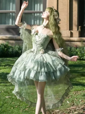 Enchanted green off-shoulder fairy lolita dress featuring 3D floral appliques and tiered ruffled skirt rear three-quarter view outdoor European setting