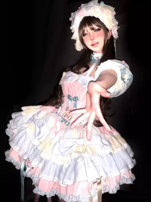 Complete Lolita coordinate set with puff sleeves bow decorations pastel colors brunette model dark background medium shot JSK dress with coordinating pieces