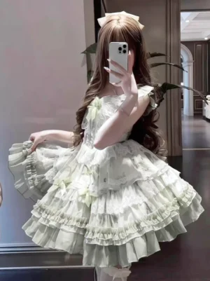 Girl wearing green and white fairy JSK dress with tiered ruffles and lace trims indoor mirror selfie