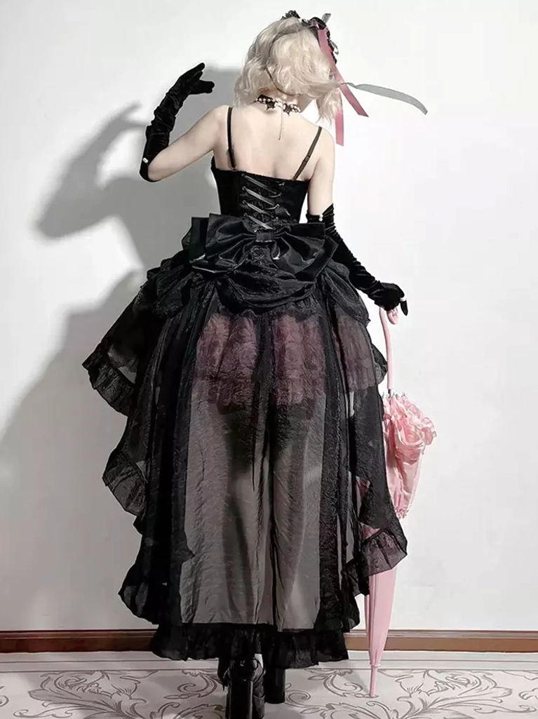 Backless fairy lolita dress back view featuring lace-up corset back design, large back bow embellishment, sheer tulle skirt layers, and blonde model with lolita styling