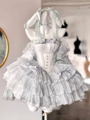 Celestial blue fairy lolita dress front three-quarter view with rabbit ear headpiece, structured corset bodice, tiered ruffle skirt, and light blue bow accents
