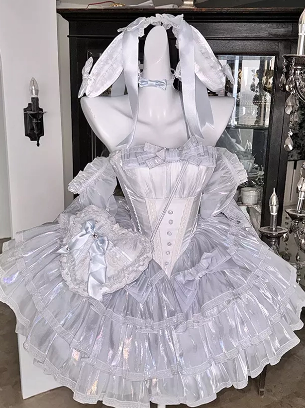 Fairy lolita ensemble front three-quarter view featuring iridescent light blue dress, matching bow choker, rabbit ear headpiece, and coordinating detachable bow purse