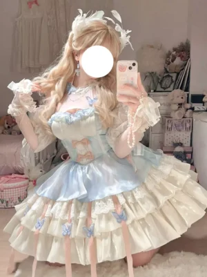 Front three-quarter view of light sky blue fairy sweet lolita dress with halter neck, tiered cream ruffles, lace details and bow embellishments on blonde model in bedroom setting