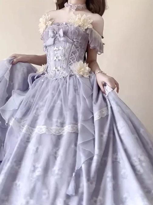 Off-shoulder floral sweet lolita fairy dress detail shot showcasing ruffled tulle layers, lace trim, floral print patterns, and structural design elements