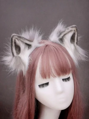 Fluffy black white fox ear Lolita headband worn on pink-haired mannequin, close-up front view showcasing plush ear design and detailed craftsmanship for sweet Lolita fashion