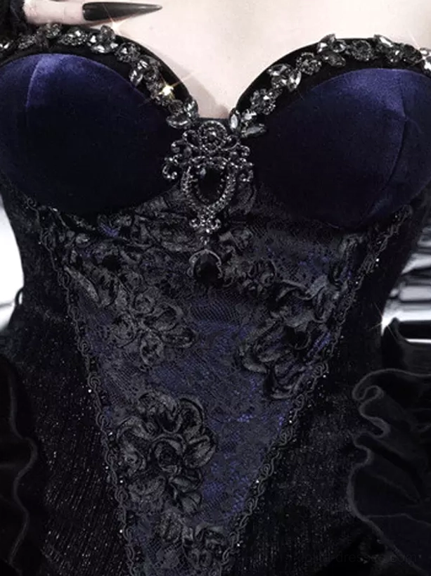 Full gothic lolita corset ensemble with black velvet bustier as focal point paired with coordinated lace and ruffled skirt layers