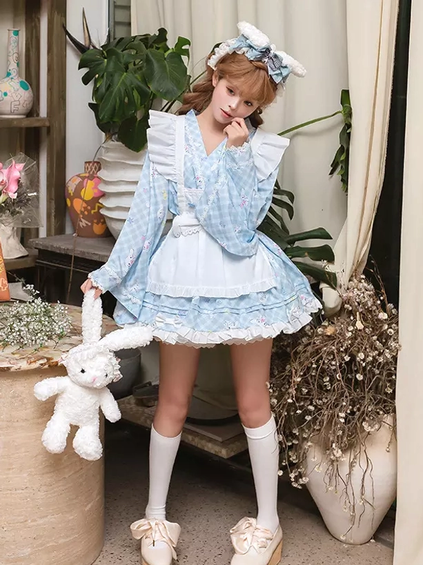 Maid-style lolita kimono dress side front angle displaying ruffled shoulder flounces structured bodice and decorative bow details model holding plush rabbit accessory