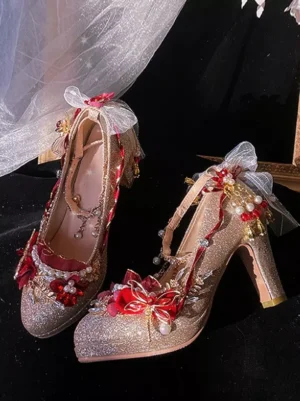 gold-glitter-lolita-bridal-pumps-front-three-quarter-view-pearl-chains-red-bows-round-toe-sweet-lolita-wedding-shoes
