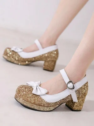 Gold glitter Mary Jane Lolita shoes with white ankle strap heart buckle and white bow ornament worn on foot side view