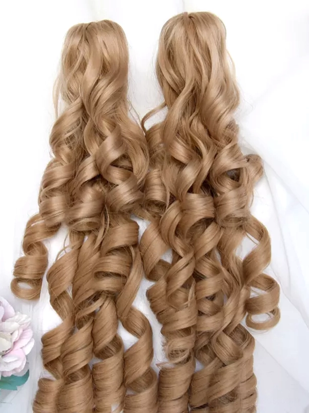 Golden-brown lolita curly ponytail hair extensions back top view showing tight large spiral ringlet curls texture warm tone