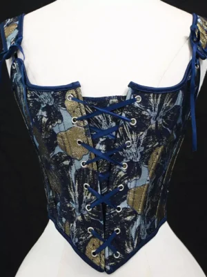 Golden and navy floral vintage lolita corset bustier back view with navy lace-up closure and tied spaghetti straps on dress form