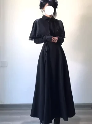 Gothic black lolita long dress with fitted long sleeves and button-up collar detail showcasing a-line floor-length skirt silhouette