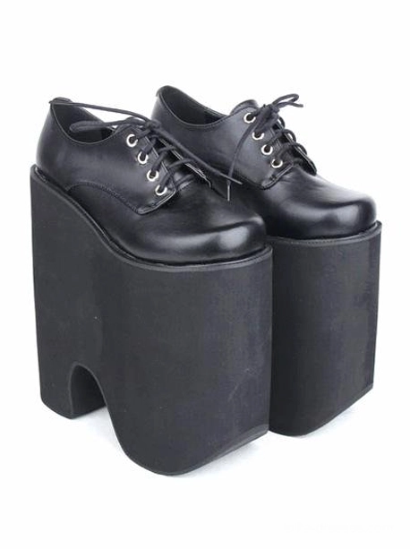 Pair of black Gothic Lolita platform lace-up shoes, slightly angled front paired view displaying blocky high platform heels, round toe caps, and matte textured sole with complete lace-up system