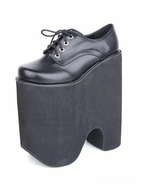 Single black Gothic Lolita platform lace-up shoe, three-quarter front side view showcasing ultra-high block platform heel, round closed toe design, and metal eyelet lace-up closure system