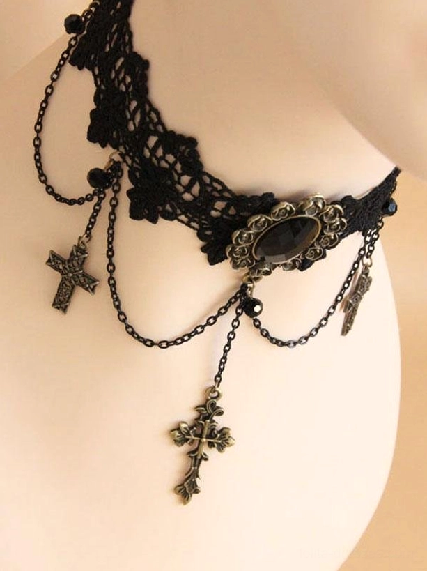 gothic choker necklace rear view showing black hollow lace collar with central oval black gem decoration and antique bronze cross drop chains