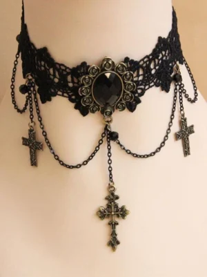 black gothic lace choker front view displaying hollow lace neckband with central black gem decoration and multiple cross drop chains