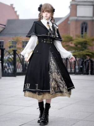 Gothic Classic Lolita three-piece ensemble black and white color scheme featuring hooded capelet, white puff-sleeve blouse with ruffled collar, and black pleated castle print skirt with Roman numeral details on European street setting