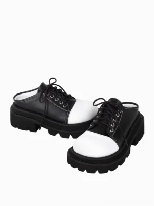 Side profile view of gothic lolita backless lace-up mules displaying metal eyelets thick rubber platform sole and padded collar interior design