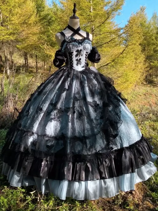 Close-up detail of 3D floral embellishments and dimensional flowers on gothic Lolita ball gown bodice