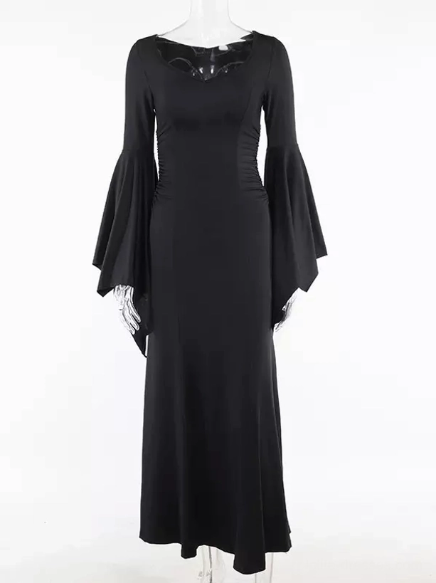 Gothic mermaid dress on mannequin display showing front full-body cut with bell-shaped bat sleeves, tassel trim details, and floor-length fitted mermaid silhouette