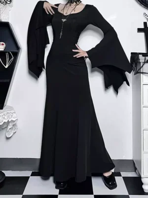 Black gothic evening gown with bat-shaped flared sleeves and floor-length mermaid skirt, three-quarter side view showing fitted waist and elegant draping
