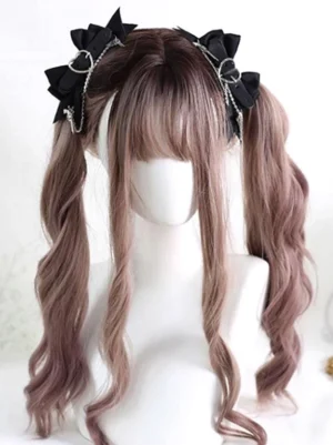 Gothic Lolita black bow hair clips with silver chains and gun charms displayed on mannequin with brown twin curly wigs, left front angle view