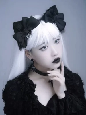 Dual black bow hairpins gothic lolita accessory with metal charm and cross choker necklace, side three-quarter front view