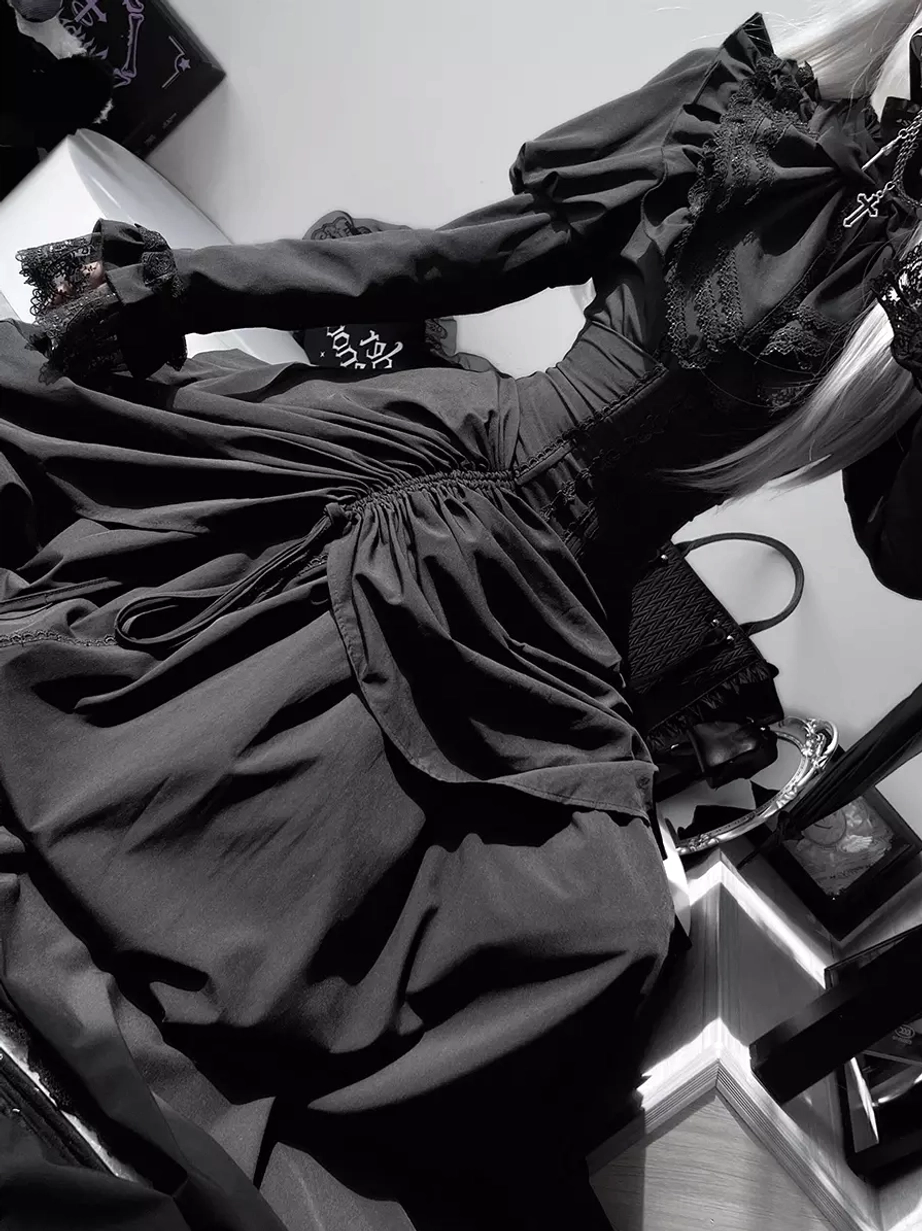 Gothic black lolita dress set seated indoor photo with veiled hat, umbrella prop, bag accessory, ruched full skirt, and lace ruffled details