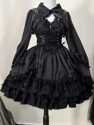 Black gothic lolita two-piece dress set with long bishop sleeves, corset lace-up front, cross charm details, and multi-layered ruffled lace skirt - front view on mannequin