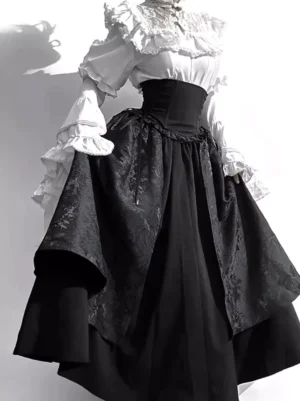 Gothic lolita two-piece black dress set with ruffled white blouse and high-waisted jacquard skirt, side three-quarter view showing bell sleeves and corset waist construction