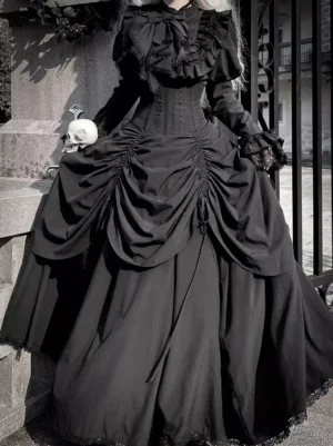 Gothic black lolita dress set full-body front view with ruffled collar and corset waist worn outdoors at vintage gate with skull prop