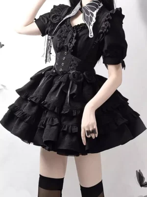 Gothic lolita outfit side view showing corset waist design, layered ruffled skirt, butterfly collar tassel trims, and model wearing black thigh-high socks