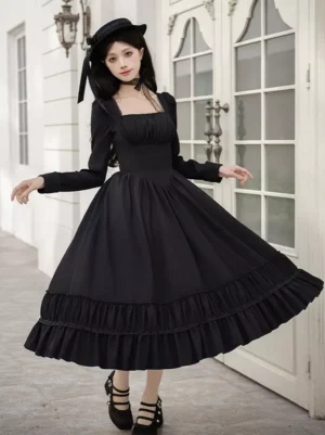 Full front view of Gothic Lolita black midi dress with square neckline long sleeves tiered ruffled hem European doorway background
