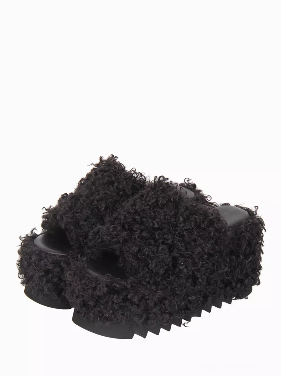 Gothic lolita black fluffy platform sandals three-quarter top-down view showing curly faux fur upper and serrated thick sole open toe design