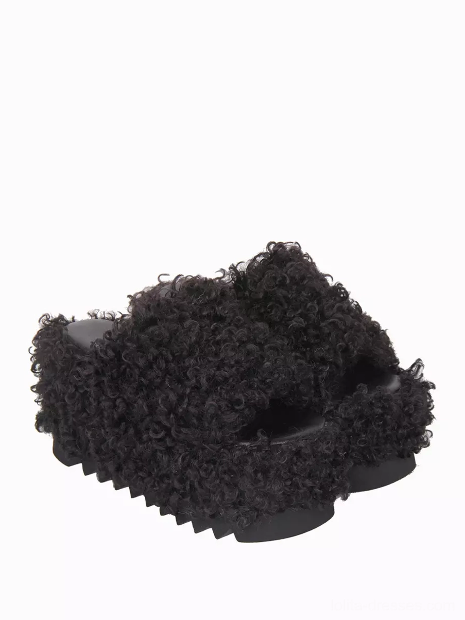 Black gothic lolita chunky platform sandals front three-quarter view showing full fleece covered upper and thick platform sole