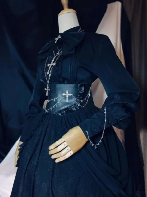 Full Gothic lolita black formal dress set featuring PU leather waist chain corset with matching silver cross chain sleeve pendant accents three-quarter view