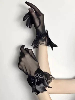 Gothic lolita oversleeves in black tulle mesh with satin wrist bows and floral lace trim, side arm view displaying drape and construction quality