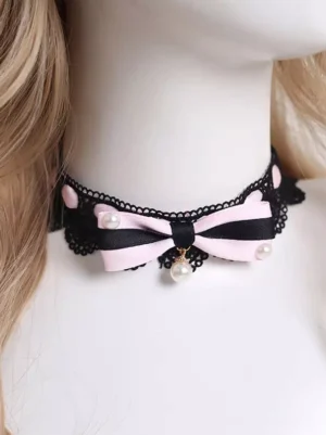 Gothic lolita black lace choker with pink satin bow and pearl accents worn on mannequin - front partial view showcasing design details